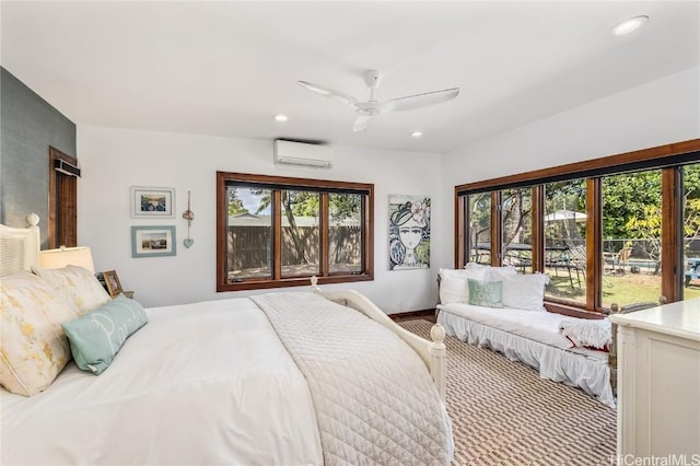 bedroom featuring ceiling fan, an AC wall unit, and recessed lighting