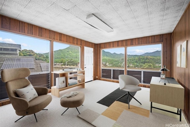 sunroom with a mountain view