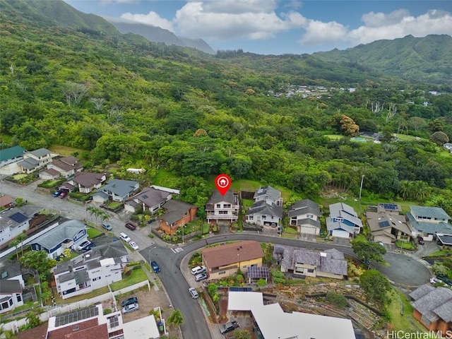 birds eye view of property with a forest view, a mountain view, and a residential view