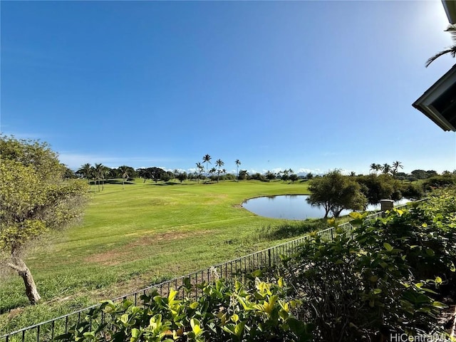 exterior space featuring view of golf course and fence