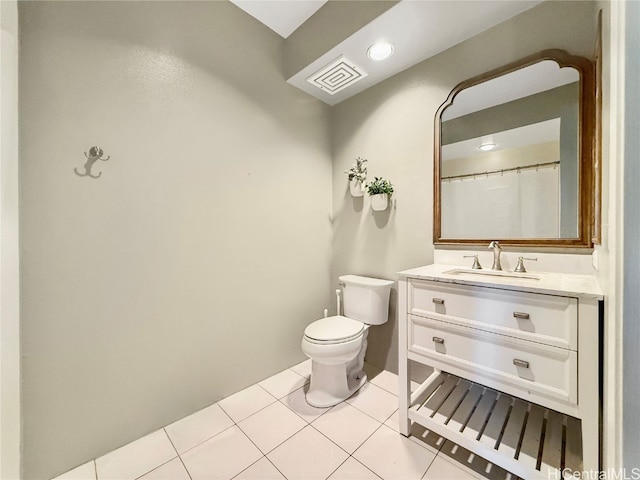 full bath featuring toilet, tile patterned flooring, and vanity