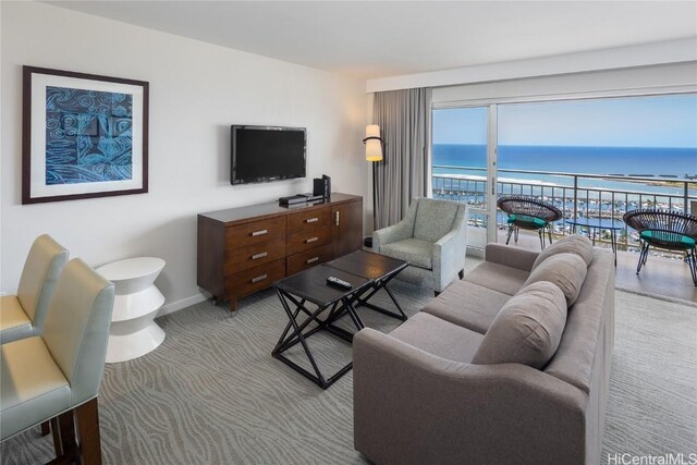 1777 Ala Moana Blvd Unit 2208, Honolulu, HI 96815 - living area with baseboards and light colored carpet