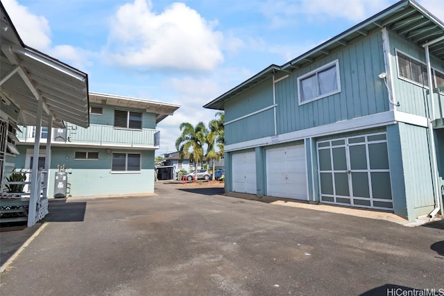 view of property exterior with a garage