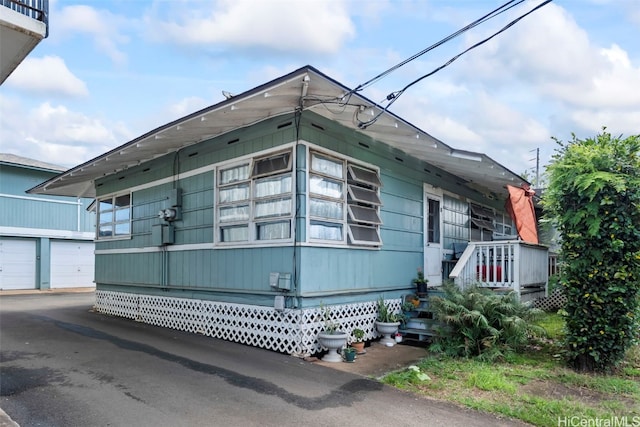 view of side of property with a garage