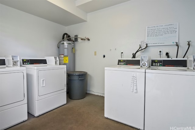 common laundry area featuring electric water heater and washing machine and clothes dryer