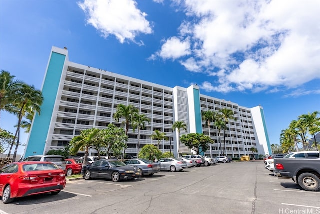 view of property with uncovered parking