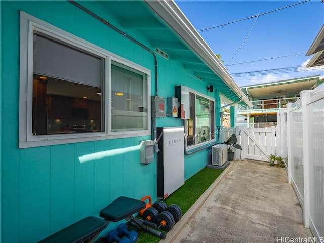 view of patio featuring fence and a gate