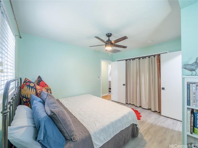 bedroom featuring a ceiling fan and light wood-style flooring