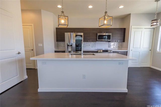 91-1159 Kamakana St Unit 542, Ewa Beach, HI 96706 - kitchen with stainless steel appliances, a sink, light countertops, dark brown cabinetry, and recessed lighting