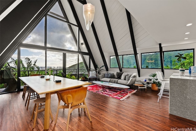 interior space with plenty of natural light and lofted ceiling with beams