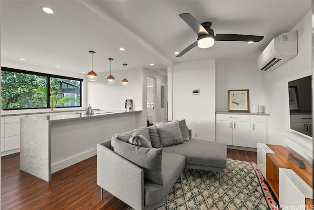 living room featuring a ceiling fan, recessed lighting, a wall unit AC, and dark wood finished floors