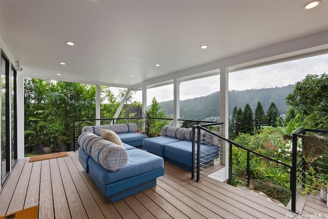 sunroom with a mountain view