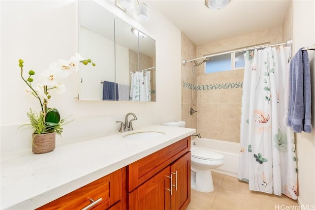 bathroom with toilet, tile patterned flooring, shower / bath combo with shower curtain, and vanity