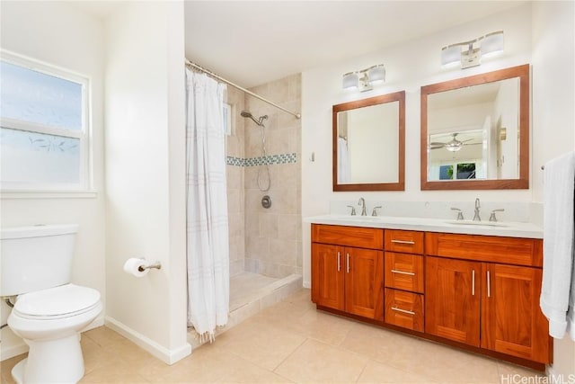 full bathroom featuring a stall shower, a sink, toilet, and double vanity