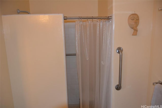 bathroom featuring a shower with curtain