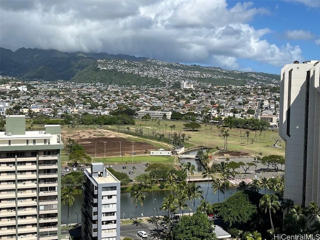 birds eye view of property featuring a water and mountain view