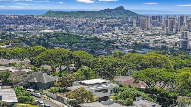 birds eye view of property featuring a view of city and a mountain view