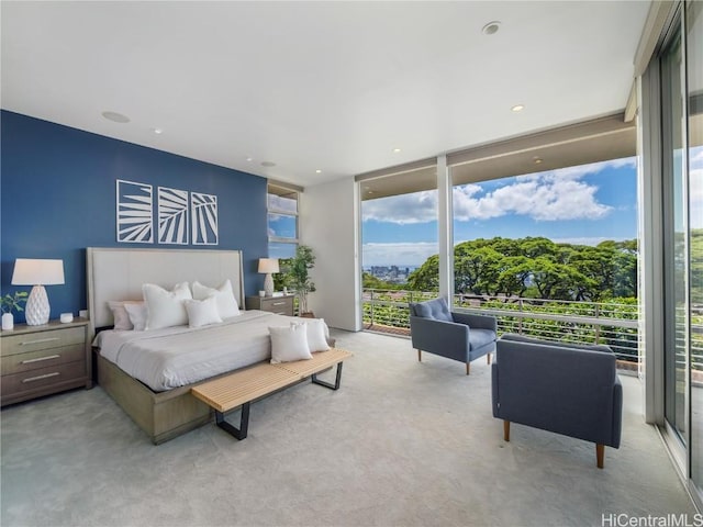 bedroom with light carpet, access to outside, a wall of windows, and recessed lighting