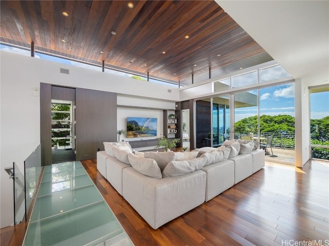 living area featuring recessed lighting, wooden ceiling, floor to ceiling windows, and wood finished floors