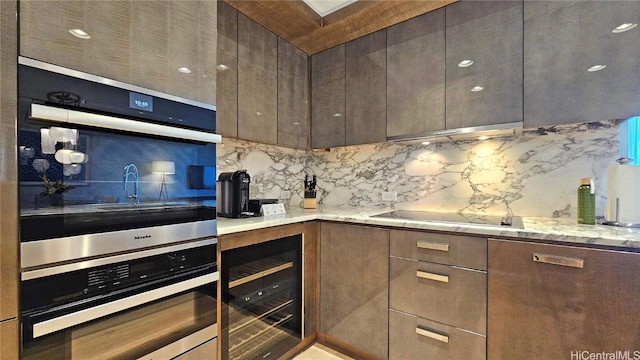 kitchen featuring backsplash, wine cooler, black electric cooktop, and dark brown cabinets