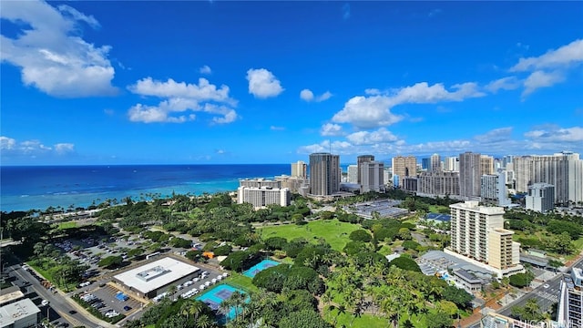 birds eye view of property with a view of city and a water view