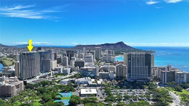 property's view of city featuring a water and mountain view