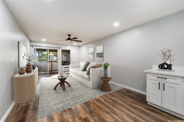 living room featuring recessed lighting, ceiling fan, baseboards, and dark wood finished floors