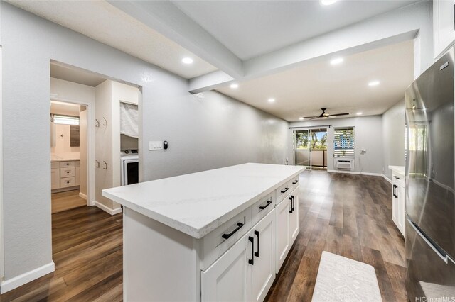 kitchen featuring white cabinetry, a ceiling fan, dark wood-type flooring, and freestanding refrigerator