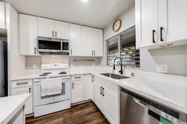 kitchen with stainless steel microwave, white cabinetry, a sink, white range with electric stovetop, and dishwasher