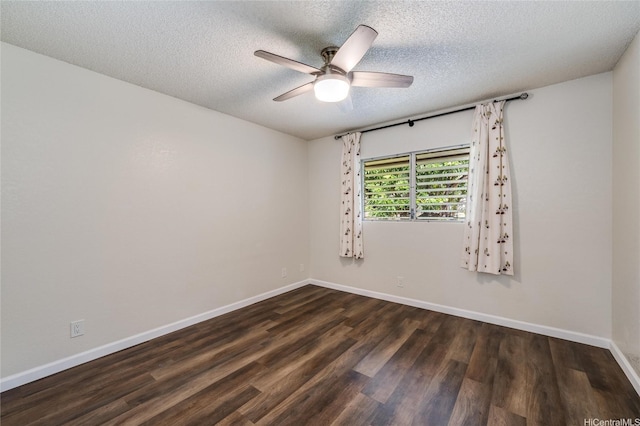 empty room featuring a textured ceiling, ceiling fan, wood finished floors, and baseboards