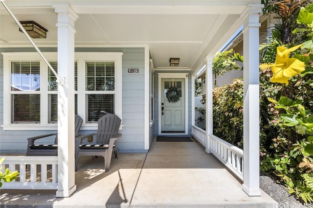 doorway to property with covered porch