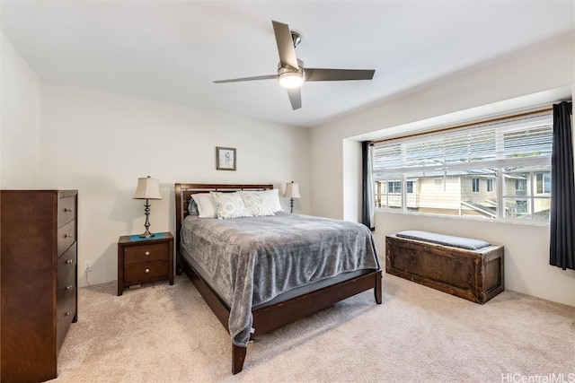 carpeted bedroom featuring a ceiling fan