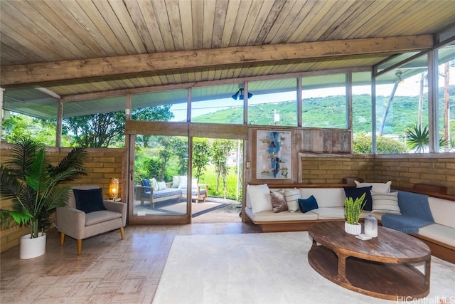 sunroom / solarium featuring wood ceiling