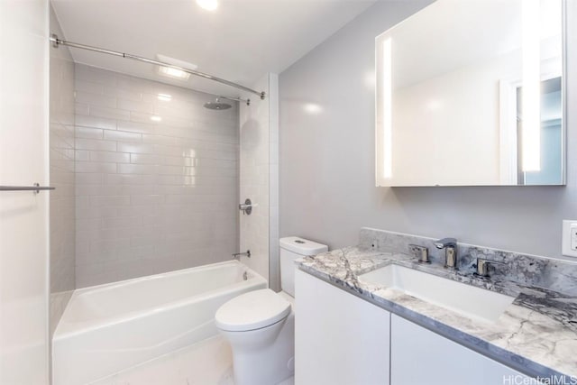 full bath featuring toilet, vanity, and bathing tub / shower combination