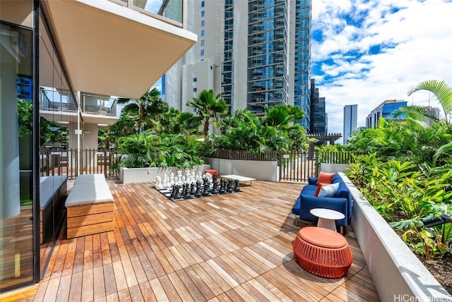 wooden deck featuring a view of city