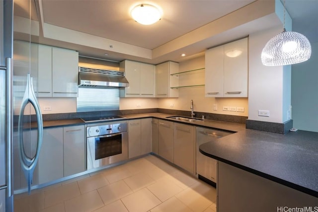 kitchen featuring a sink, white cabinets, appliances with stainless steel finishes, ventilation hood, and dark countertops