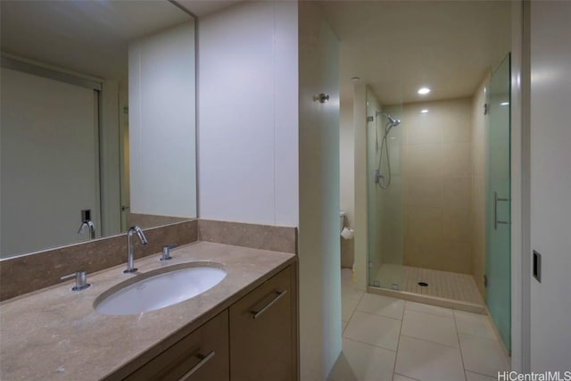 bathroom with recessed lighting, tile patterned floors, a shower stall, and vanity