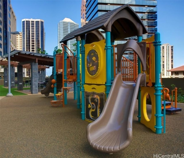 community playground featuring central AC unit and a city view