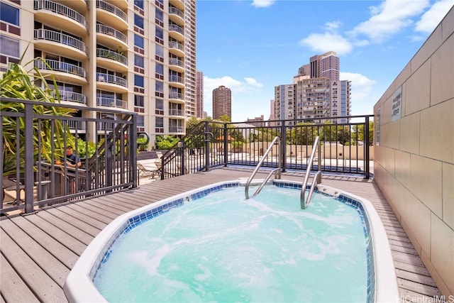 view of swimming pool with a city view