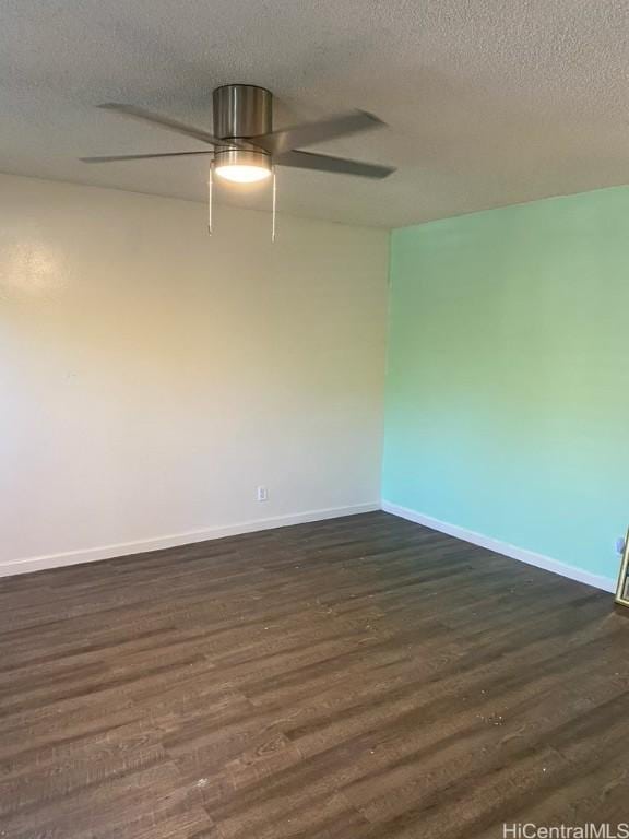 unfurnished room with a ceiling fan, dark wood-style flooring, a textured ceiling, and baseboards