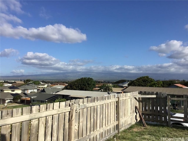 exterior space with a residential view and fence