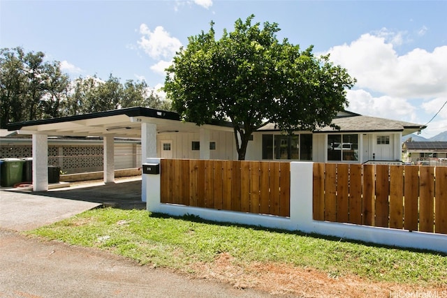 219 Loko Pl, Wahiawa, HI 96786 - view of front of property featuring a fenced front yard, driveway, and a carport