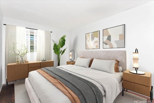 bedroom with wood finished floors