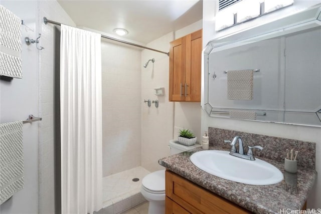 full bath with a shower stall, toilet, and vanity