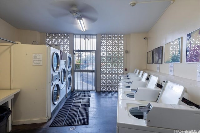 laundry room with stacked washer / dryer and a ceiling fan