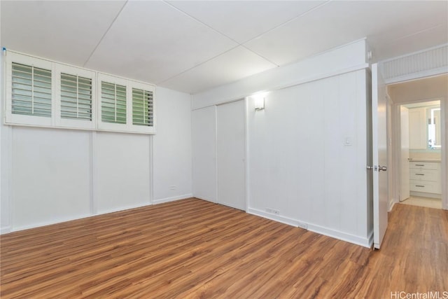 spare room featuring wood finished floors