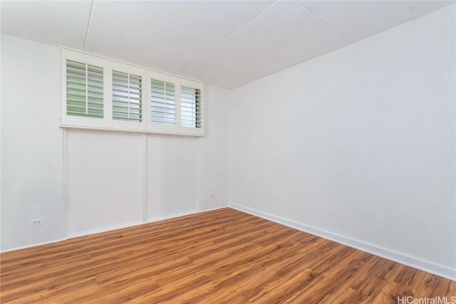 empty room with wood finished floors