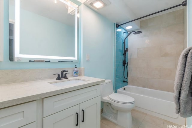 full bath with toilet, tile patterned floors, shower / washtub combination, and vanity