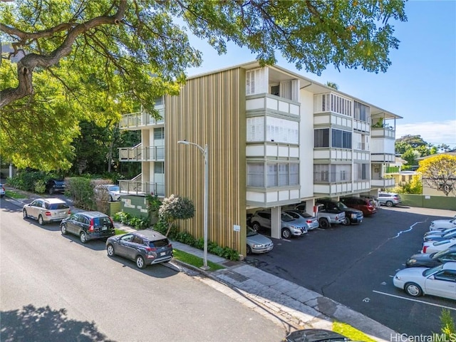 view of property with uncovered parking