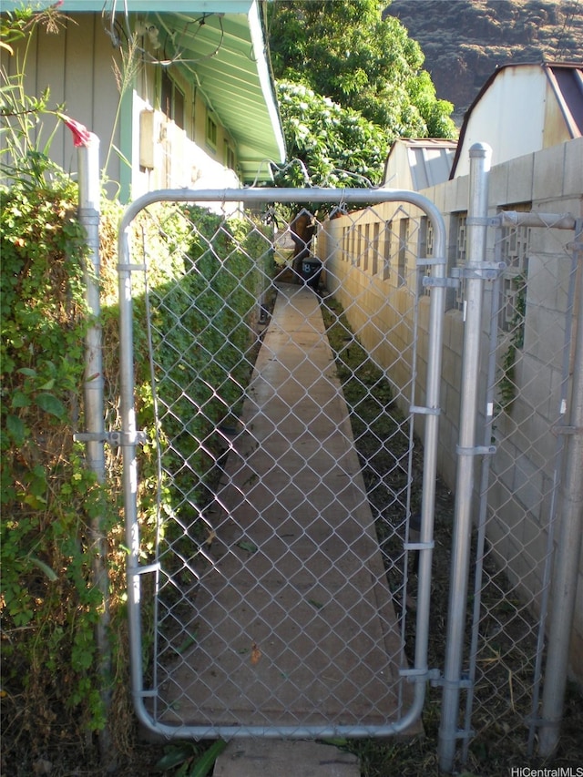 view of gate featuring fence